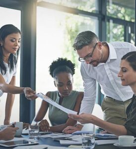 Team of people trying to figure out insurance